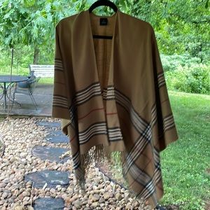 Tan, black, white, and red open front poncho